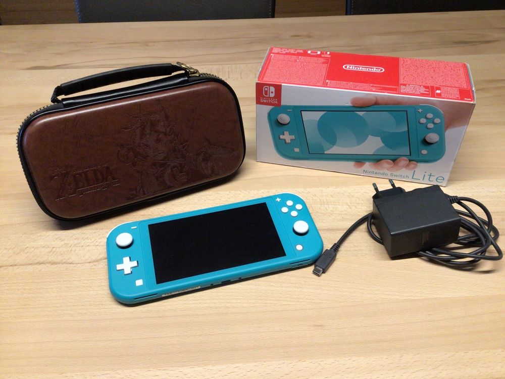 Nintendo Switch Lite türkis mit Zelda Case Acheter sur Ricardo