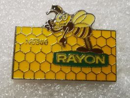 Ansteckpin 9: Nestle Rayon