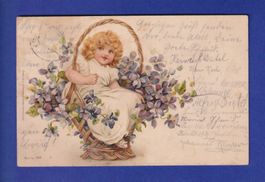 ENFANT - Petite fille dans une corbeille de fleurs