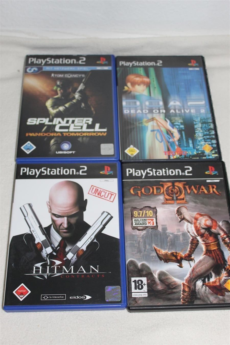 Sony Spiele: DoA 2,GOW II,Hitman Contr,Pandora Tomm. – Gebraucht aus Reinach BL von Haexli_46