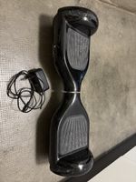 Hoverboard noir avec chargeur bon état