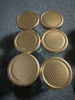 28 leere Honiggläser