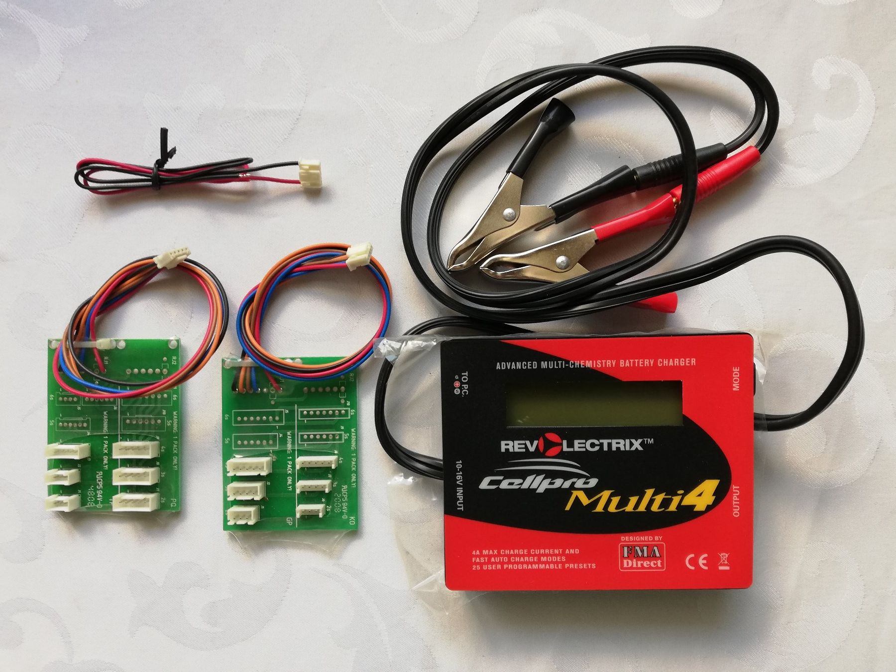 Modellismo RC: Revolectrix Cellpro Multi4 Ladegerät 12V – Nuovo e nell'imballaggio originale da Flüh venduto da AMS-Modellbau 1