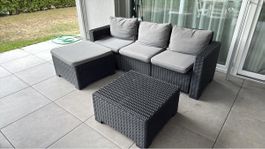 Gartensofa Rattanset dunkelgrau mit Tisch und Hocker