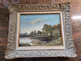 Gemälde "Kühe am See" von E.Robert, gerahmt.