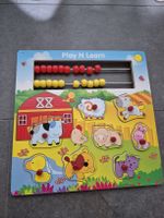 Holz-Puzzle mit Tieren und Rechenrahmen für Kinder
