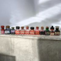 12 anciens flacons d'encre différentes couleurs et marques