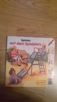 Buch Spielen auf dem Spielplatz