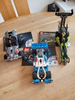 Drei Autos Lego-Technik mit Aufzugsmotor und Bauanleitung