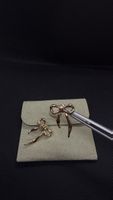 Charming Gold Ribbon Earrings - A Timeless Accessory!