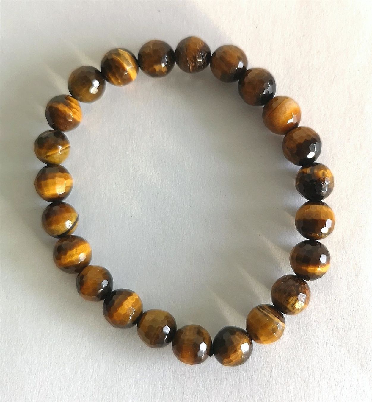 Bracciali & Braccialetti: Tigerauge Armband, facettiert Beads 8mm – Nuovo e nell'imballaggio originale da Rümlang venduto da 21f