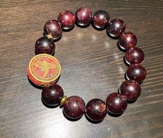 ✨Armband aus Granat mit tibetischem Amulett ✨