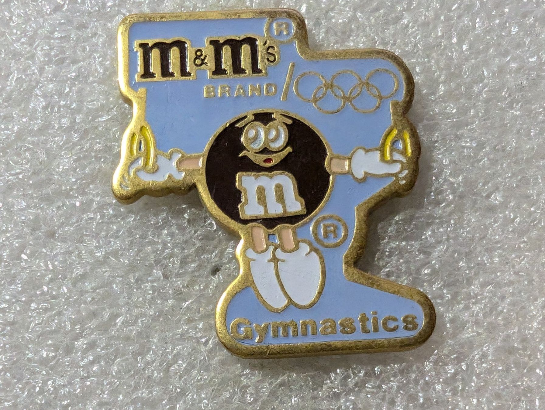 Plaketten & Abzeichen: Ansteckpin 201: m&m's x Olympia – Gebraucht aus Oppligen von Pin-Fall-Shop