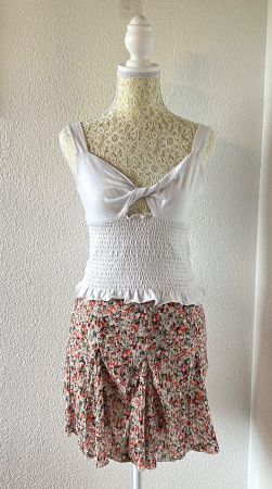 White tank top with ruffle trim and floral skorts