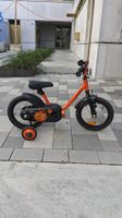 Kinderfahrrad Btwin orange mit Stützrädern
