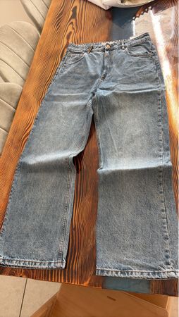 Jean femme bleu coupe large état comme neuf