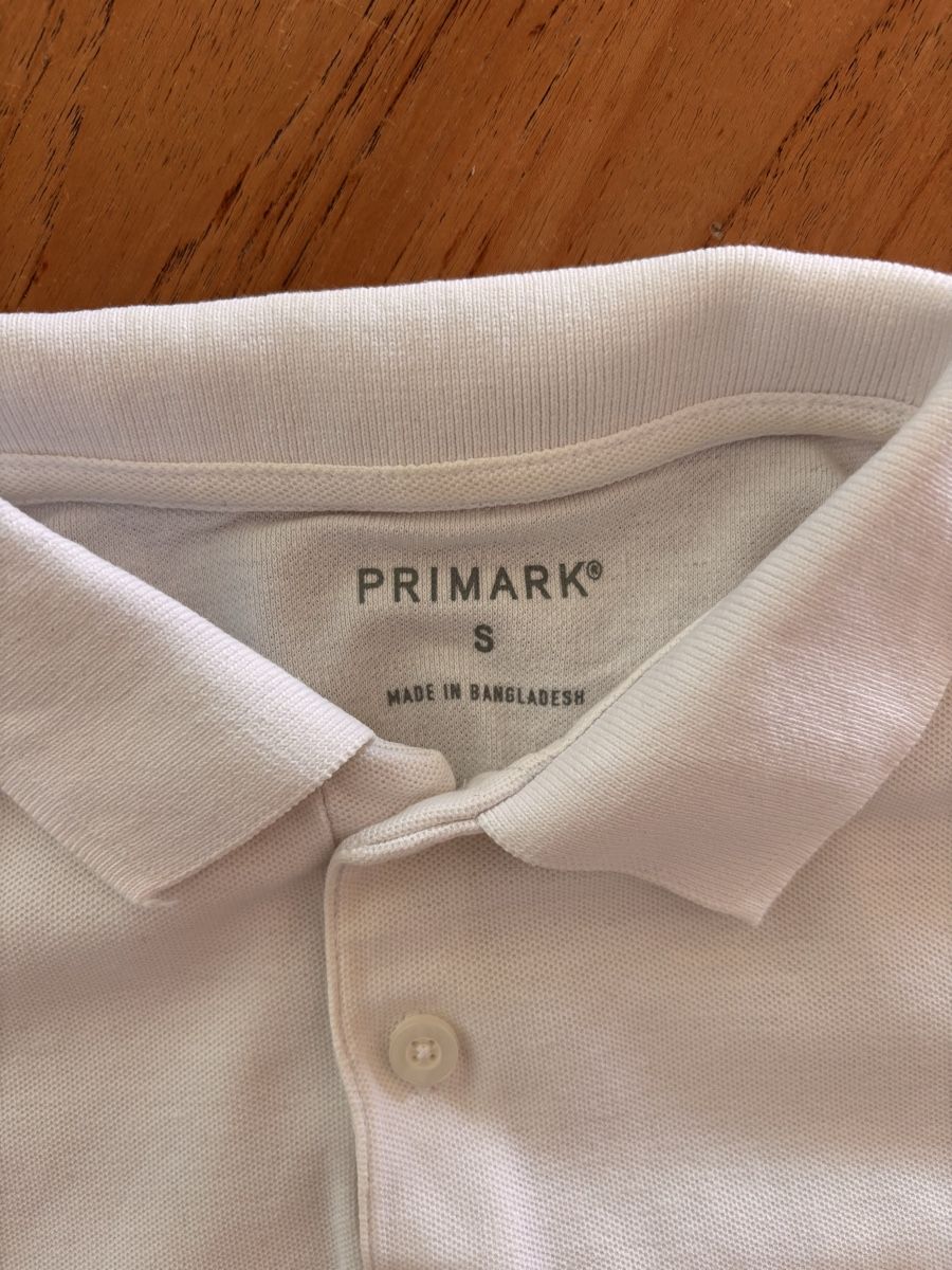 Primark Magliette Polo: Primark white polo shirt. – Usato da Zürich venduto da Grothschild 2