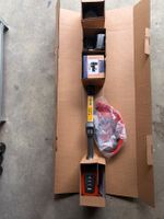 Husqvarna 215iL neu mit Akku und Ladegerät.