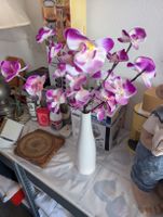 Künstliche Orchideenzweige leuchtend 