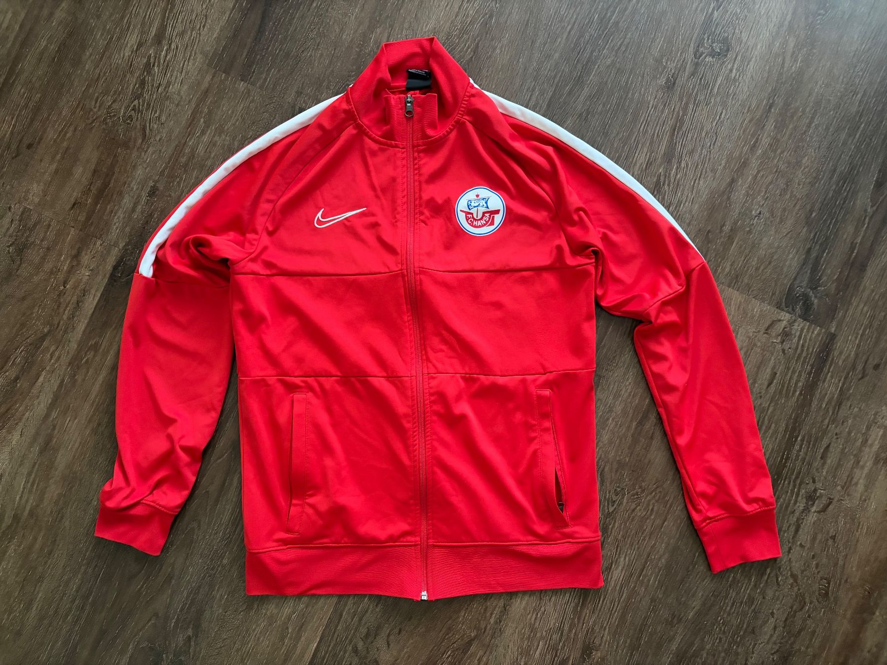 Nike Maillots de corps & Pantalons: Hansa Rostock Traineroberteil Gr. M – D'occasion à Muttenz par bargain_hunter