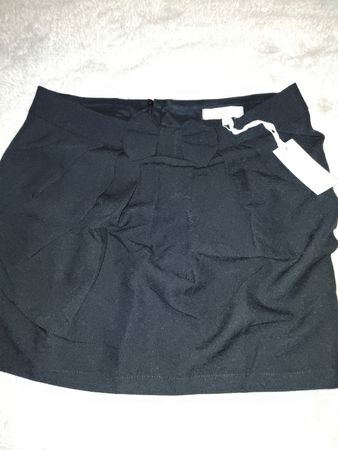 Jupe courte noire avec nœud taille S état neuf