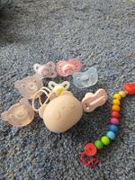 Unused baby pacifiers, baby brush & spoons