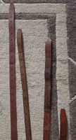 Quatre longues sangles.