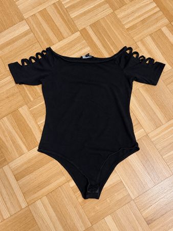 Body noir épaules découpées en excellent état taille S/M