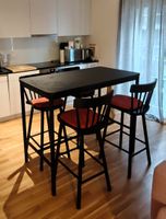 Bar table with chairs and cushions