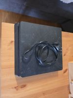 Console Sony PlayStation 4 Slim noire avec câble secteur