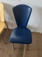 3 blue leather chairs. 