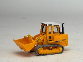 VE1- Kibri Schaufel Lader mit Raupen orange