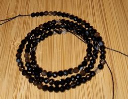 Achat (Agate) schwarz 3mm. facettiert Strang