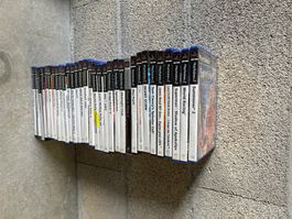 Lot de 32 jeux vidéo PlayStation 2 en bon état général