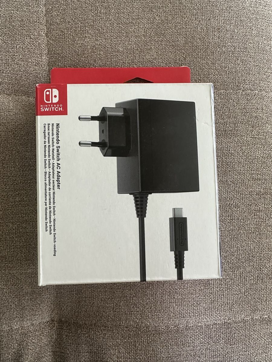 Nintendo Adattatori & Cavi: Nintendo Switch Netzteil Originalverpackt – Nuovo e nell'imballaggio originale da Biberstein venduto da Koala1995
