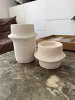 2 Kerzenständer aus Stein