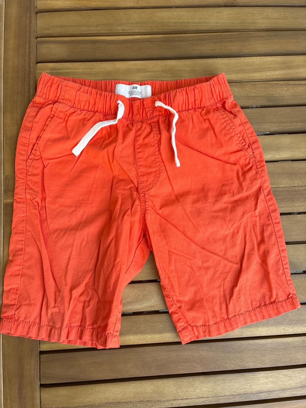 Hosen: Shorts, Stoff, orange, getragen, Gr 134 – Gebraucht aus Guntershausen von Gloominati