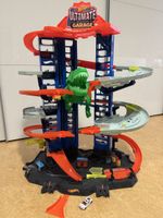Hot Wheels Ultimate Garage Spielzeuggarage mit Dinosaurier