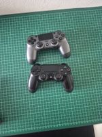 2 PS4 Controllers Black and Grey Used Condition