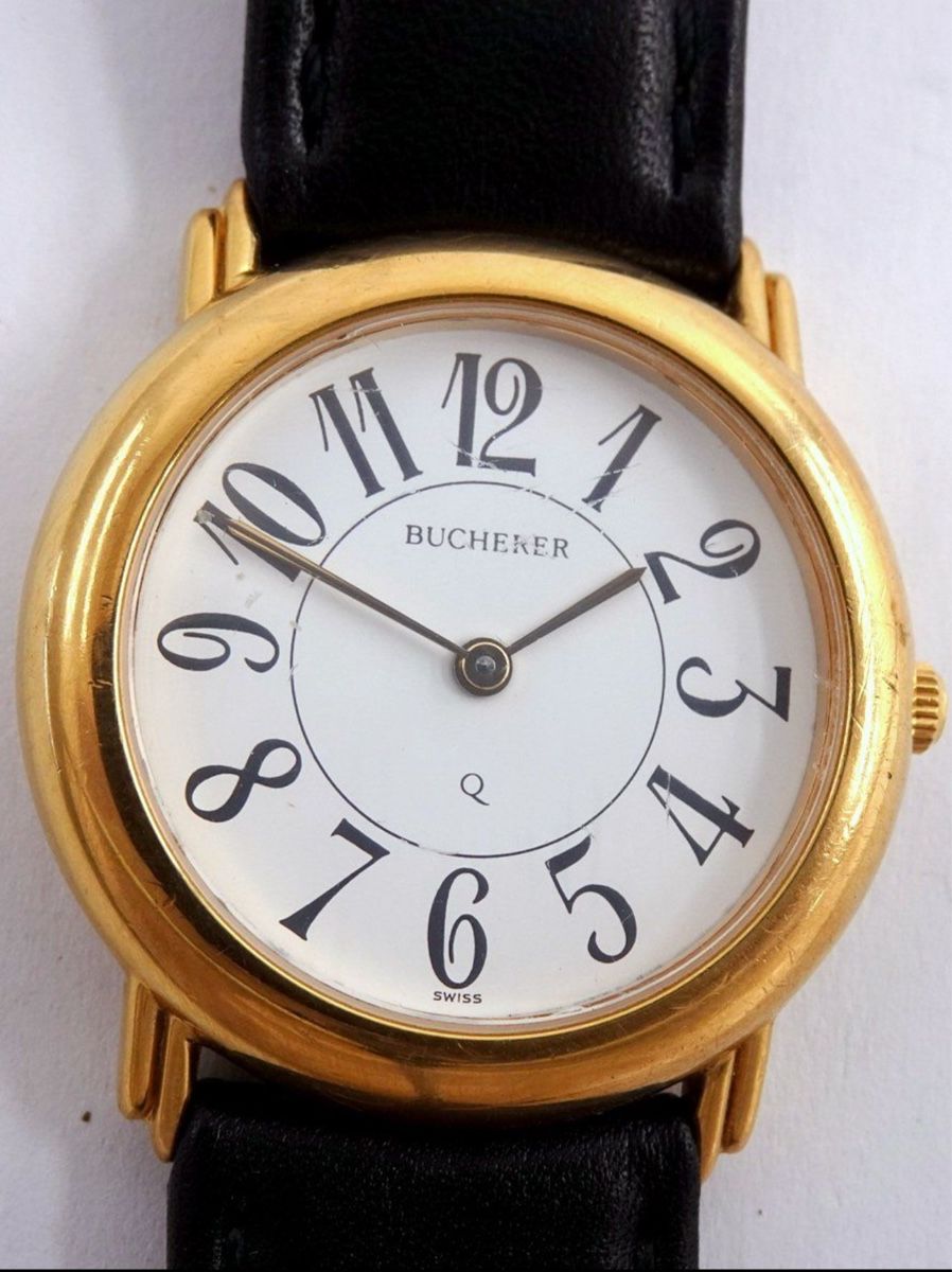 Bucherer Damenuhr, elegante goldene Uhr mit Lederarmband