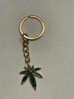 Schlüsselanhänger 8cm Hanfblatt Marihuana Anhänger gold/grün