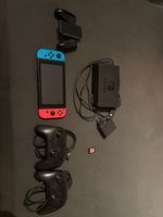Nintendo Switch + Mario Kart + 2 Pro Controller