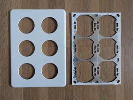 Feller Standard Abdeckung und Rahmen für 6 Stecker/Schalter