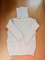 Pull beige d'hiver à col roulé