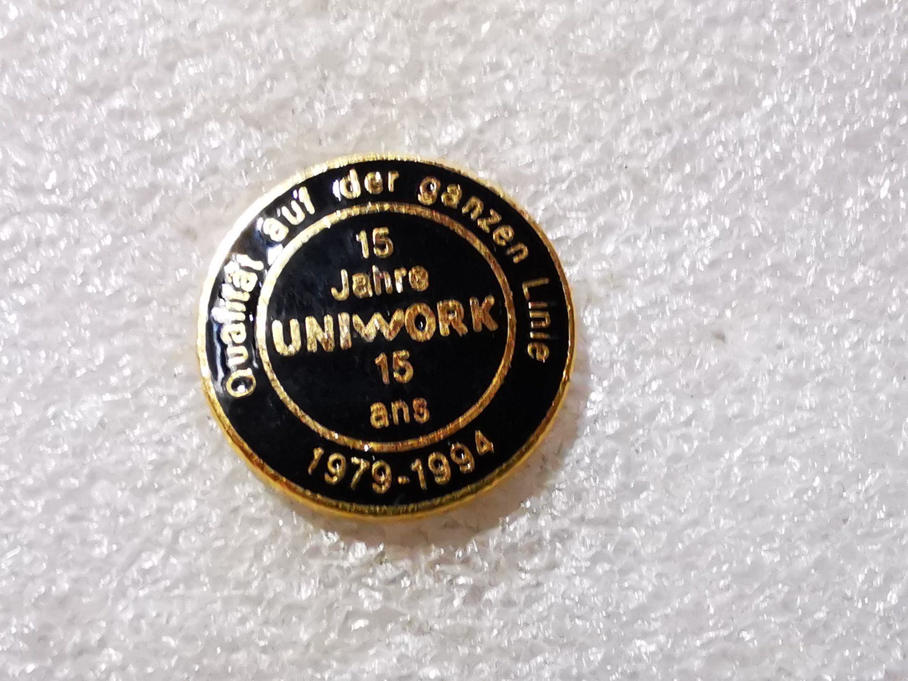 Placchette & Badge: Ansteckpin 50: Uniwork – Usato da Oppligen venduto da Pin-Fall-Shop