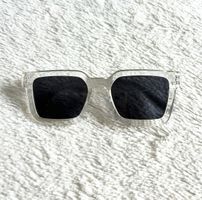 Sonnenbrille mit transparentem Rahmen