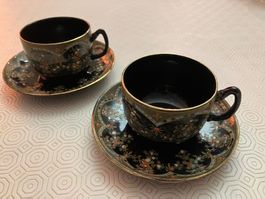 2 tazzine da caffè con piattino e decori colorati