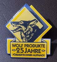 R535 - Pin 25 Jahre Wolf Produkte Fördertechnik Alpnach