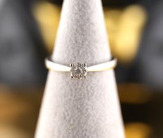 Solitärring 18K mit 9 Diamanten
