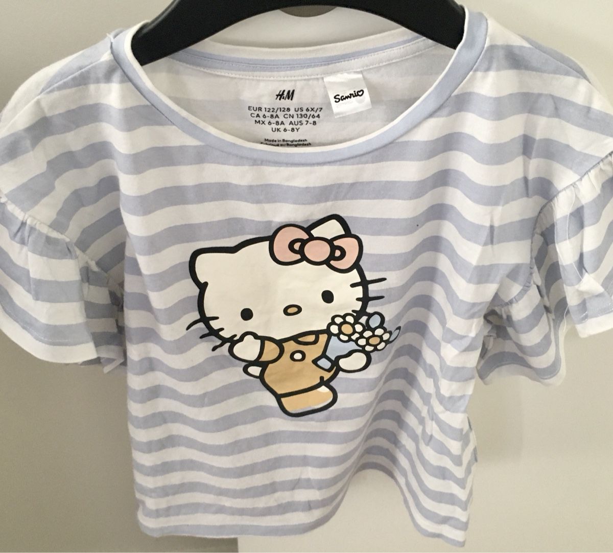H&M Camicette, T-shirt & Top: T-shirt Hello Kitty H&M rayé, taille 122/128 – Nuovo (secondo la descrizione) da Lausanne venduto da mik_l5py